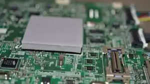 Tflex HD90000 high deflection silicone thermal pad applied to an electronic component for efficient heat dissipation.