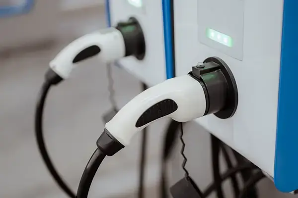 Two high-voltage heavy-duty industrial power sockets mounted on a wall in a power distribution facility.